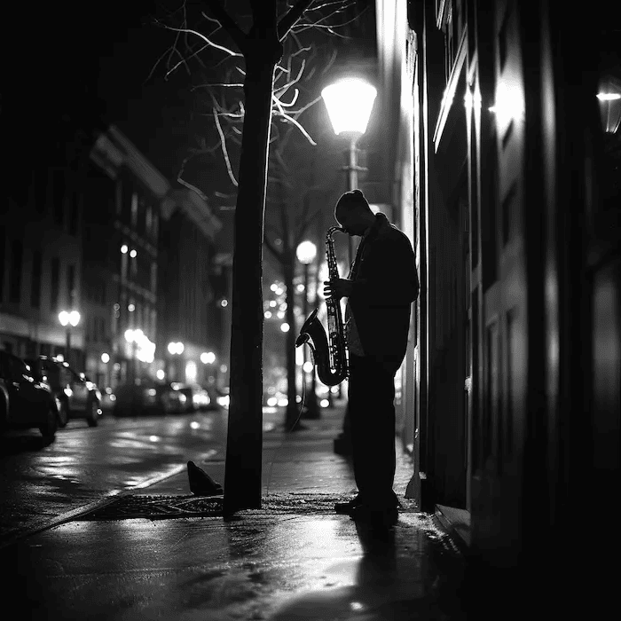 A worm's eye view extreme wide shot of a solitary jazz musician playing on empty city streets at night, with the dim glow of street lamps casting long shadows and creating a moody, reflective atmosphere, capturing the musician's intimate connection with his instrument, shot with a Sony A7S III, 35mm lens, monochrome palette with subtle amber tones from the street lights. --v 6.0 --style raw